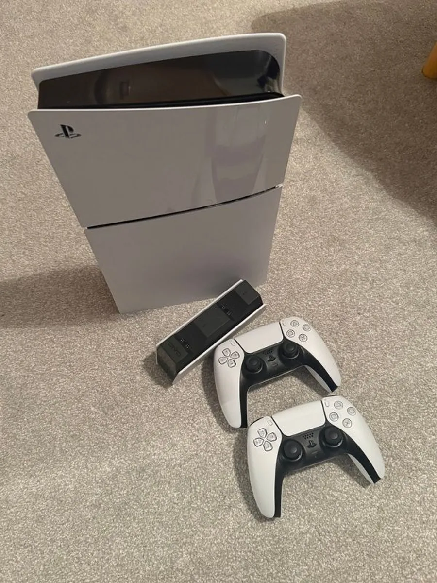 PlayStation 5 Slim with two controllers and charging station - Image 1