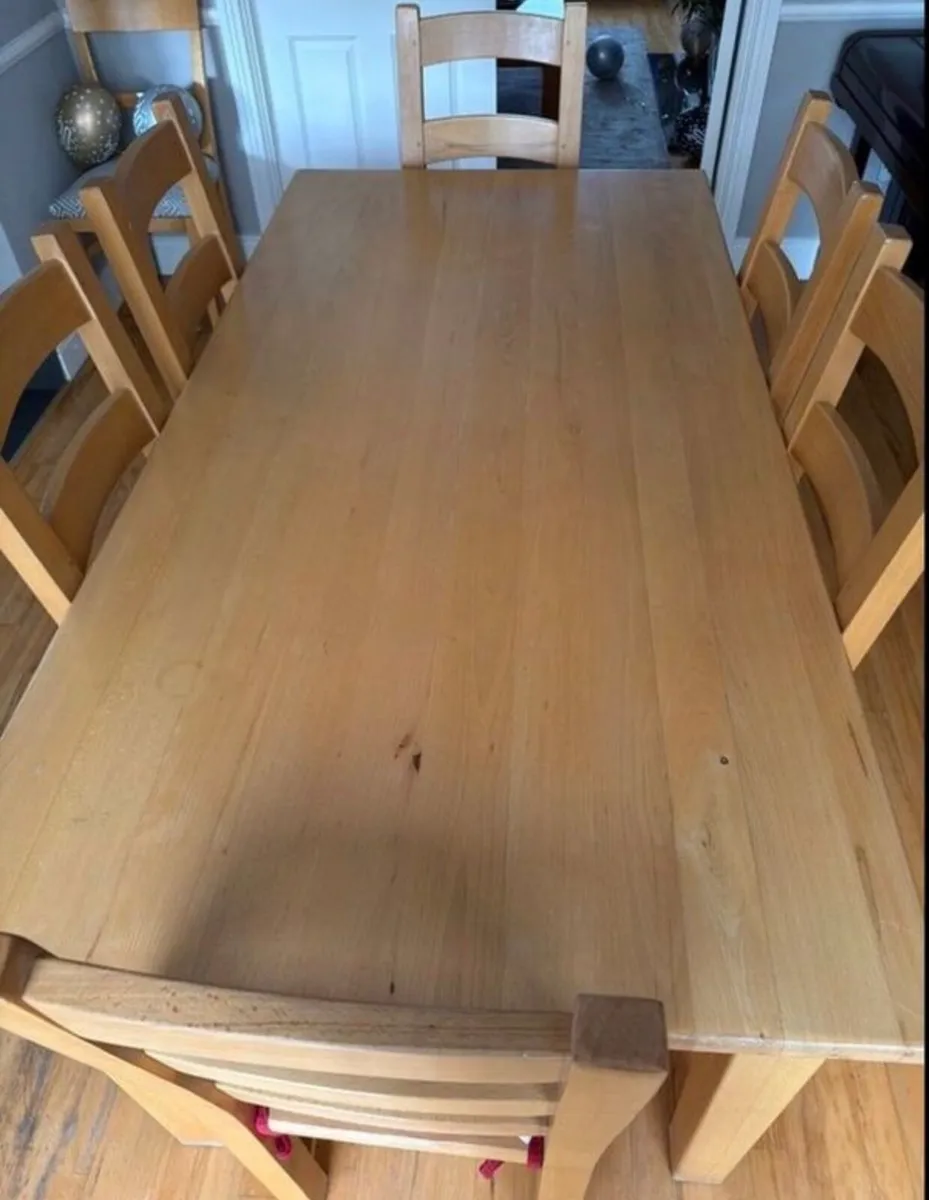 Solid wooden dining table and chairs - Image 1