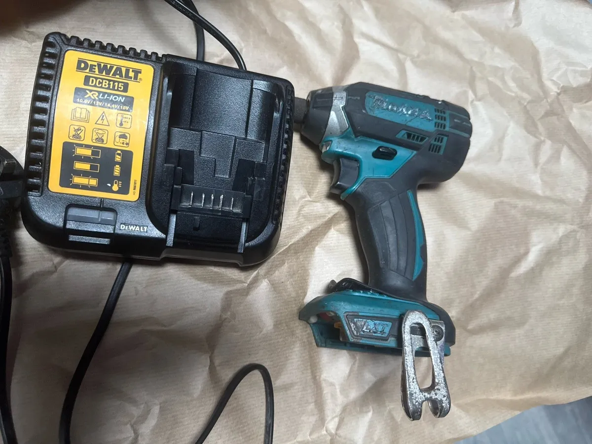 Makita impact driver and dewalt charger - Image 1